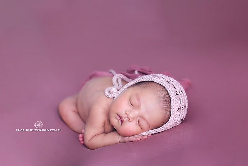 Brisbane newborn baby girl photographed on womb pose