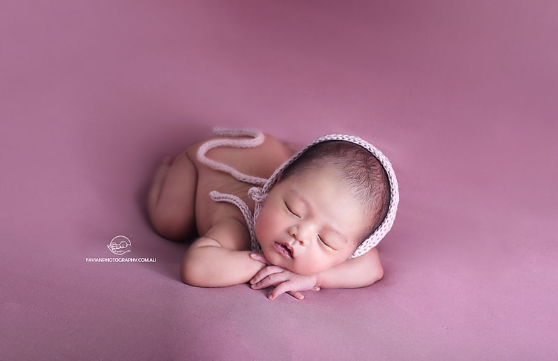 Brisbane newborn baby girl photographed in chin on hands pose